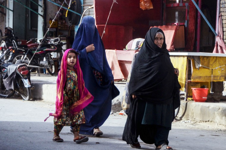 Women walk with a girl in Kandahar, Afghanistan