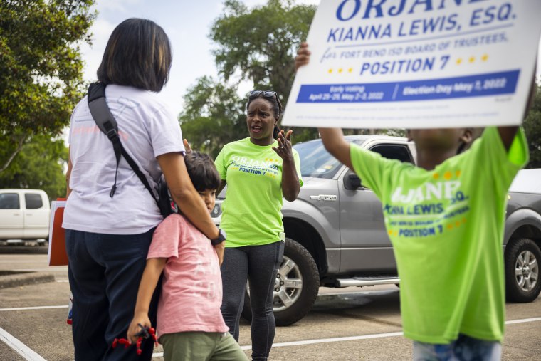 School board trustee hopeful Orjanel Lewis chats with supporters during her Election Day campaigning on May 7, 2022, in Ft. Bend County, Texas.