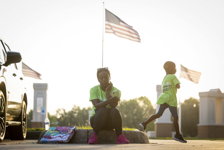 School board trustee hopeful Orjanel Lewis begins watching results after the polls close outside of the Missouri City City Hall on May 7, 2022, in Ft. Bend County, Texas.