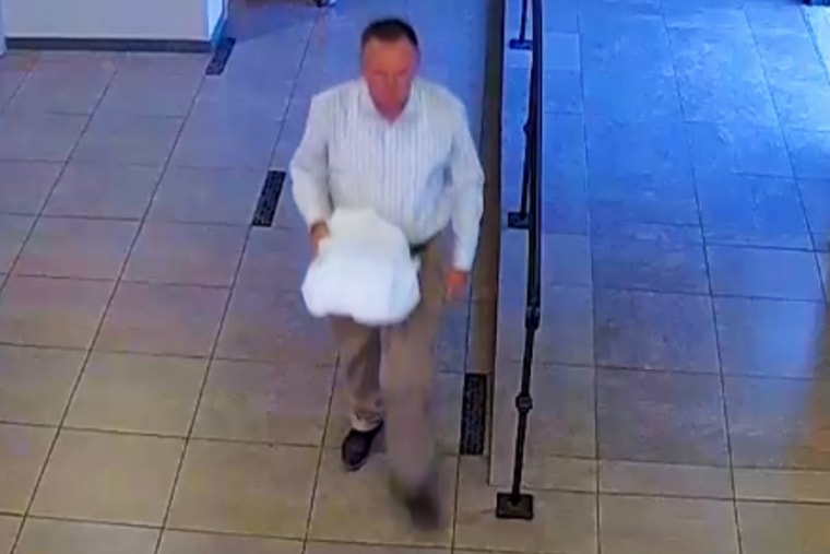Landon Earl Rankin, 54, was pictured leaving a wedding in a police-obtained surveillance video, authorities said. 