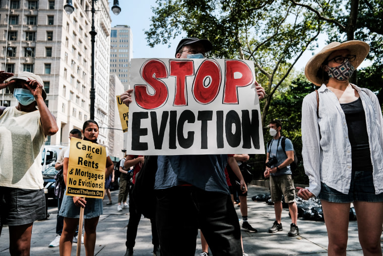 Activists hold a protest against evictions near City Hall on Aug. 11, 2021, in New York.