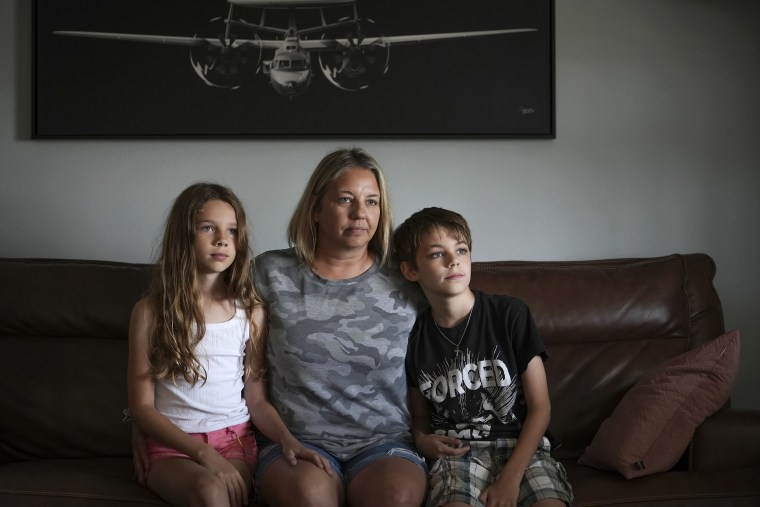 Kim Hough sits with her children, Emelia and Ethan.