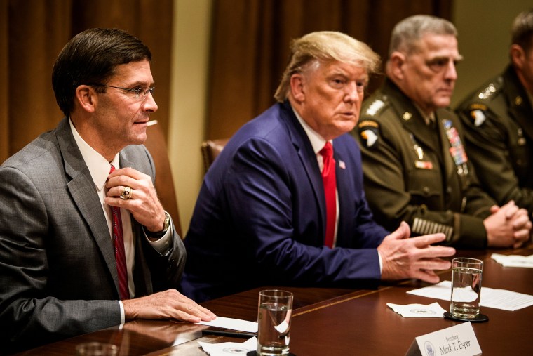 Secretary of Defense Mark Esper, left, President Donald Trump, and Chairman of the Joint Chiefs of Staff Army Gen. Mark A. Milley, right, wait for a meeting with senior military leaders in the Cabinet Room of the White House on Oct. 7, 2019.