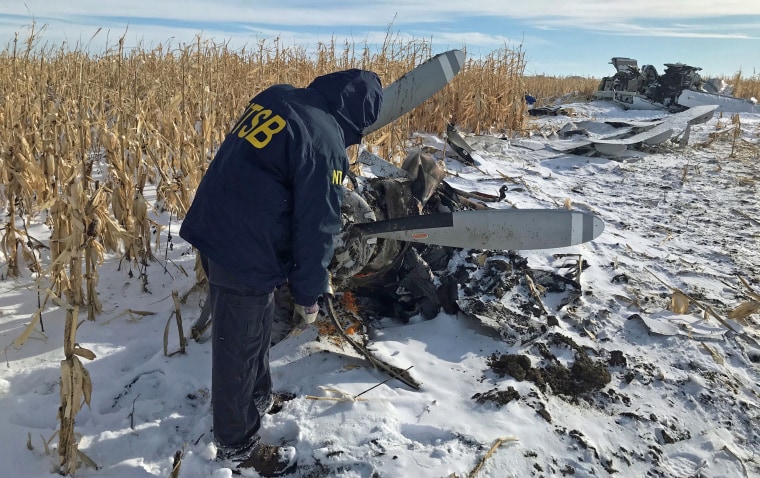 An NTSB air safety investigator begins the initial examination of the wreckage of a Pilatus PC-12 on Dec. 2, 2019, near Chamberlain, S.D.