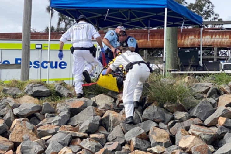 Police rescue workers recover cocaine found near the body of a diver along the Hunter River in Newcastle, Australia, on Monday. 