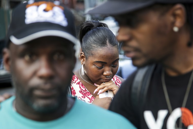 Alecia Armstrong bows her head in prayer during a Save Our Streets shooting response rally in the Bedford-Stuyvesant neighborhood of Brooklyn, N.Y., on July 24, 2018.
