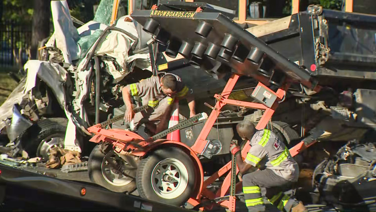 Emergency personnel respond to the scene of a school bus crash in Charlotte, N.C., on May 11, 2022.