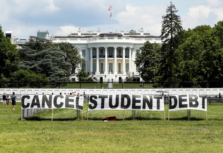 Advocates set up a sign on the Ellipse in front of the White House to call on President Joe Biden to sign an executive order to cancel student debt on June 15, 2021.