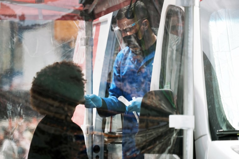 A person is tested at a Covid-19 testing van