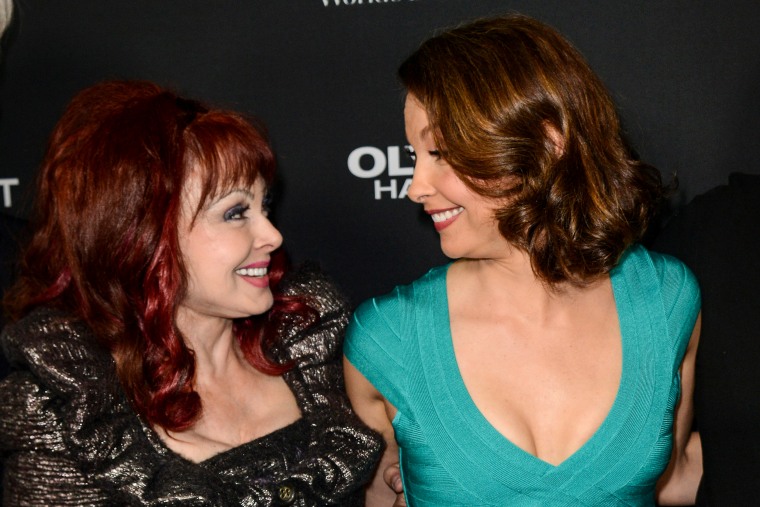 Ashley Judd, right, and her mother Naomi Judd arrive at the Los Angeles premiere of "Olympus Has Fallen" on March 18, 2013.