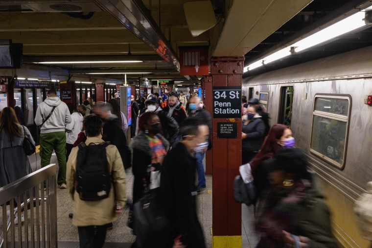People commute through the Penn Station