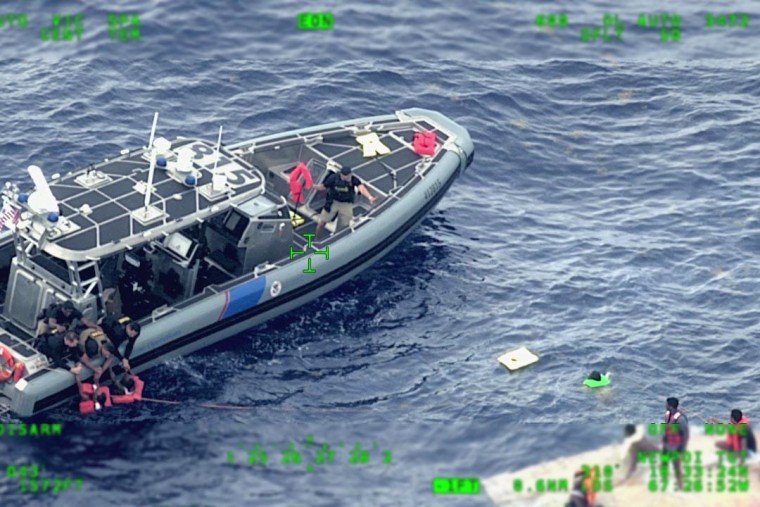 The Coast Guard attempts to rescue migrants on a boat that capsized off Puerto Rico.