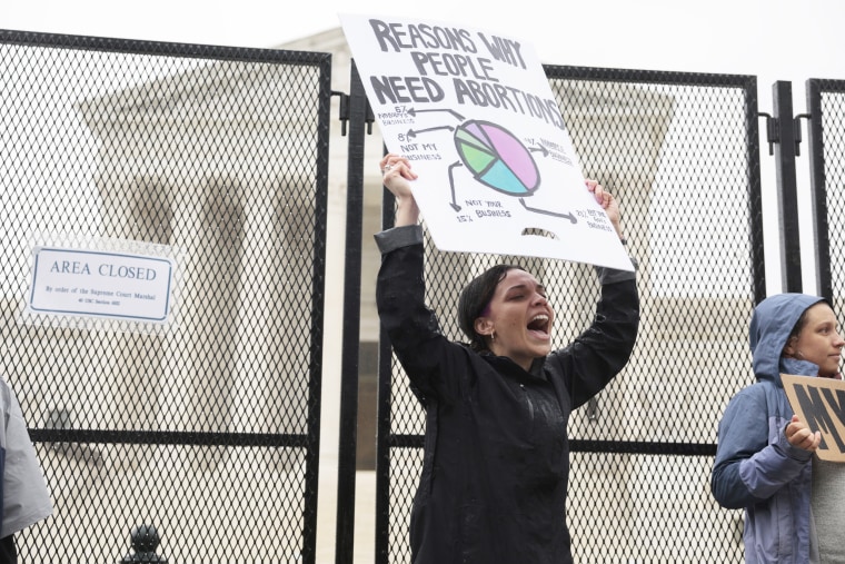 An abortion-rights protester shouts during a demonstration