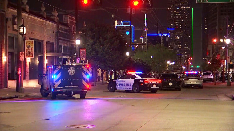 Police vehicles at the scene of a shooting in Dallas on May 13, 2022.