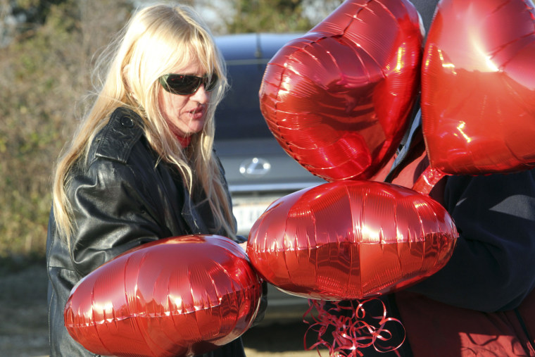 Mari Gilbert, mother of Shannan Gilbert, prepares to release balloons in her honor during a vigil in Babylon, N.Y. on Dec. 13, 2011.