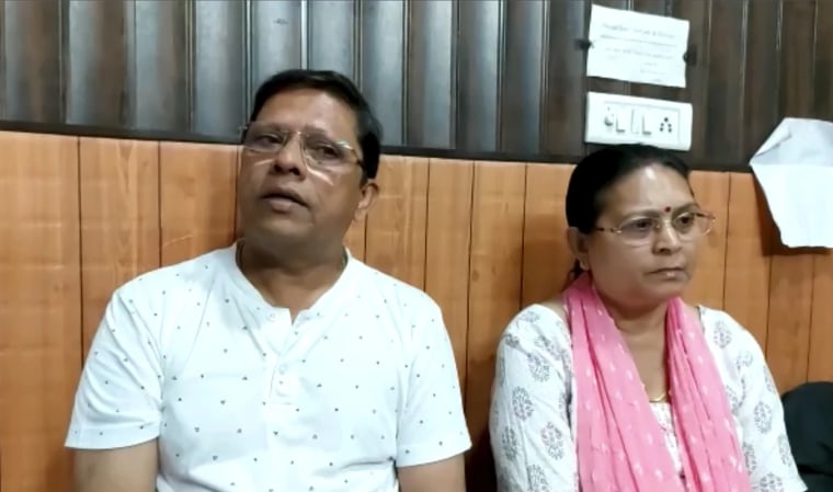 Sanjeev Ranjan Prasad and Sadhana Prasad wait at a lawyer's chamber in Haridwar, India on May 12, 2022.