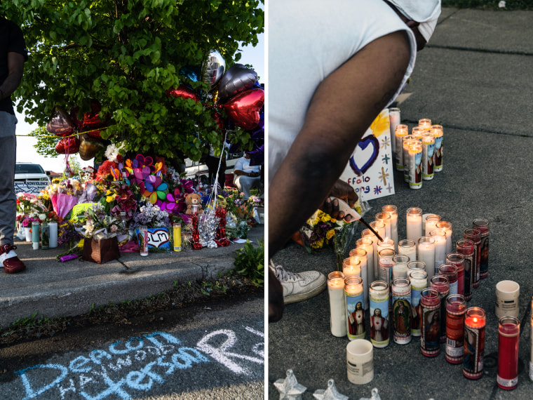 A shrine erected in memory of the fallen community members filled with signs, flowers and candles in Buffalo, N.Y., on May 15, 2022.