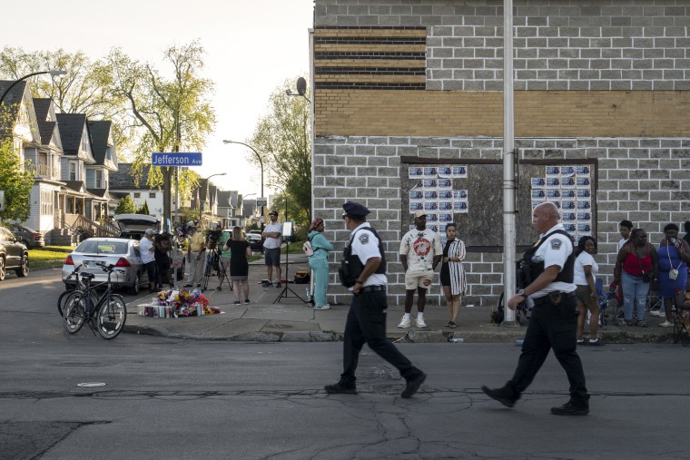 Police officers patrol near the scene of a shooting at a supermarket, in Buffalo, N.Y., on May 15, 2022.