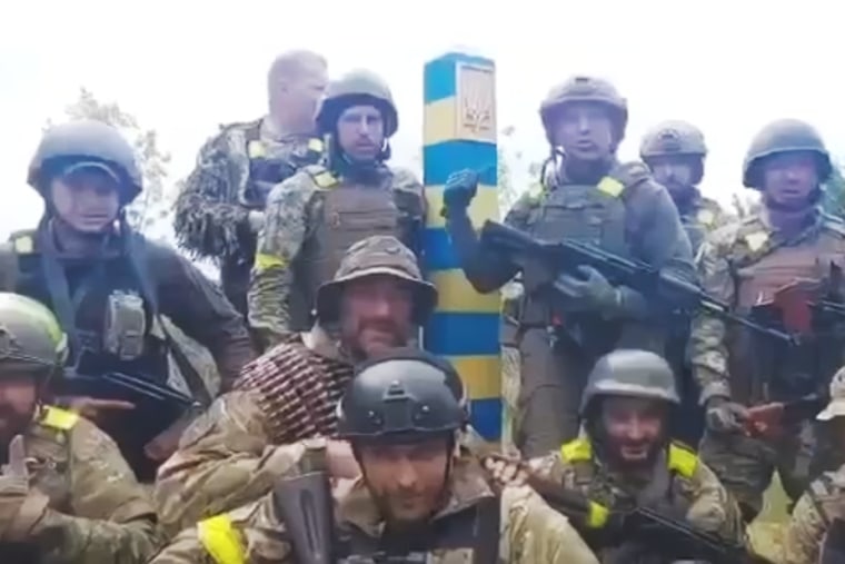 Ukrainian soldiers appear at the border of Russia in a video posted to the Ukrainian Defense Ministry's official Telegram account.