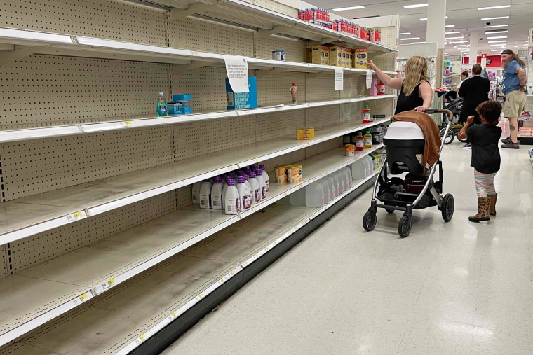 A woman shops for baby formula