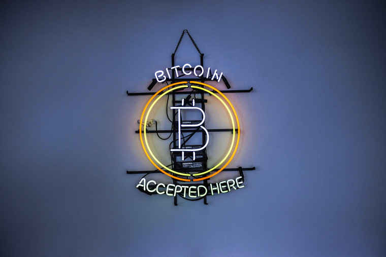 A neon sign indicates that Bitcoin is accepted inside a venue in Prague, Czech Republic, on May 17, 2022.