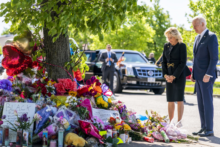 President Joe Biden and first lady Jill Biden pay their respects to the victims of Saturday's shooting at a memorial across the street from the TOPS Market in Buffalo, N.Y., on May 17, 2022.