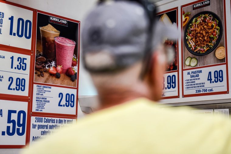 A customer views a menu in the food court of a Costco store in San Antonio, Texas, on May 30, 2018.