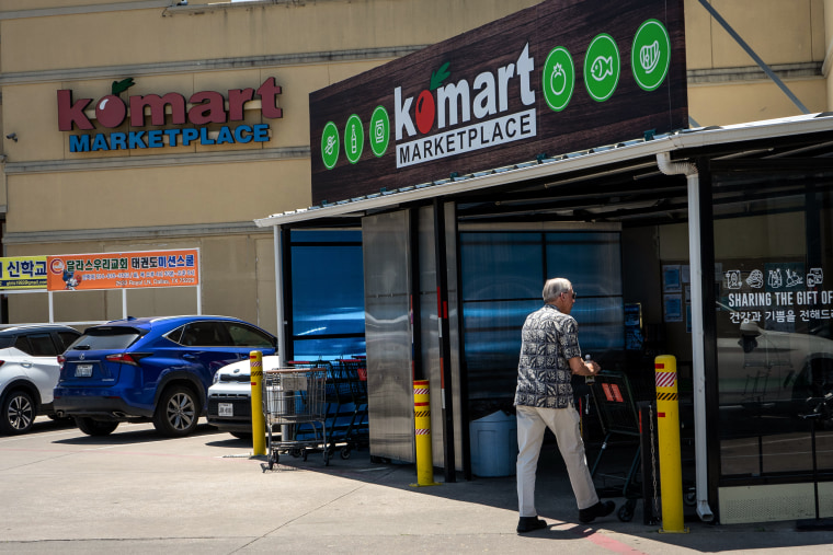 Shoppers outside the Komart Marketplace, which features Korean and other Asian specialties, in Dallas, on May 14, 2022.