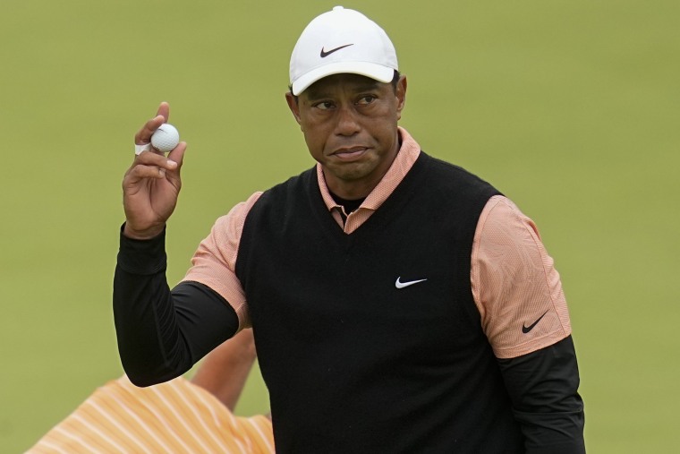 Tiger Woods waves after making a putt on the 18th hole during the third round of the PGA Championship golf tournament at Southern Hills Country Club on Saturday, May 21, 2022, in Tulsa, Oklahoma.