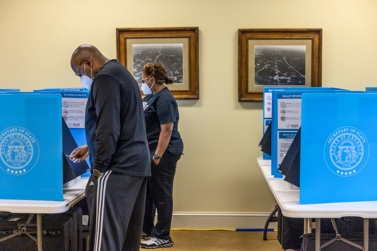 Voters cast their ballots at Buford City Hall in Buford, Ga., on May 24, 2022.