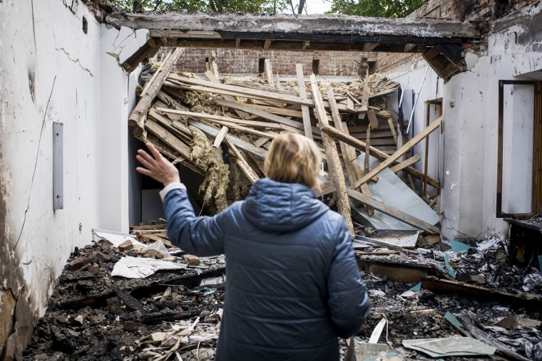 Nataliia Micay, Director of the Hryhorii Skovoroda Literary Memorial Museum, describes the damage to the Hryhorii Skovoroda Literary Memorial Museum on May 19, 2022, in Skovorodynivka, Ukraine.