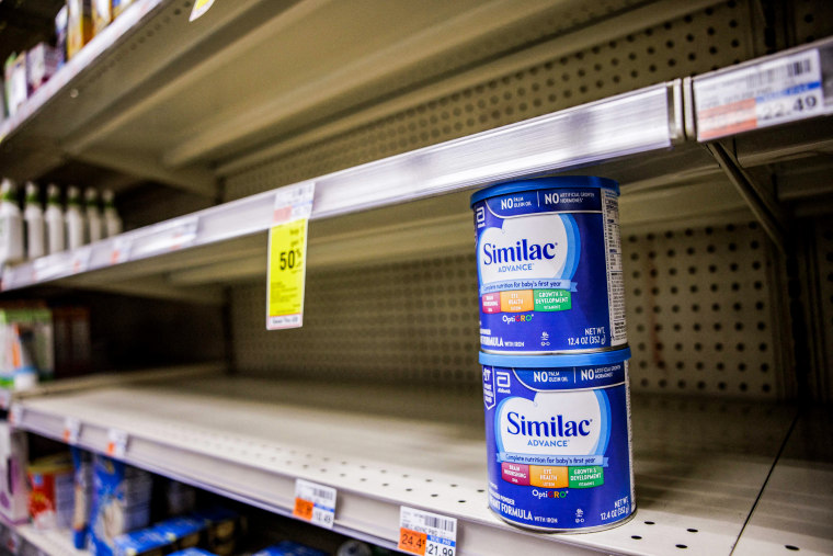 Shelves normally meant for baby formula sit nearly empty at a store in downtown Washington, DC, on May 22, 2022.