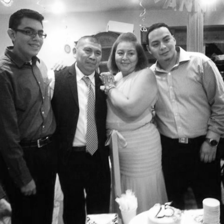 Image: Julio Ramirez, left with his parents and brother.