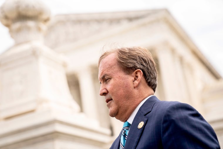 Texas Attorney General Ken Paxton speaks outside the Supreme Court in Washington on April 26, 2022.