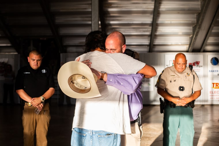 Chief Deputy Brandon McCutchen consoles community members during a vigil for the victims of the mass shooting at Rob Elementary School on May 25, 2022 in Uvalde, Texas.