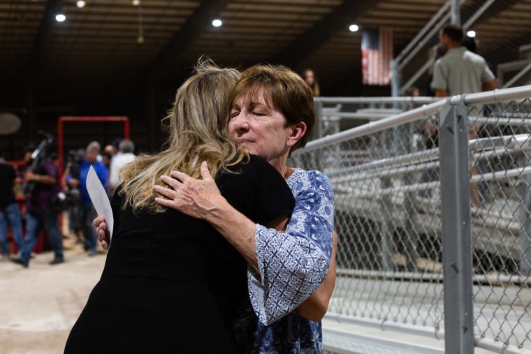 People mourn as they attend a vigil for the victims of the mass shooting at Robb Elementary School in Uvalde, Texas on May 25, 2022.