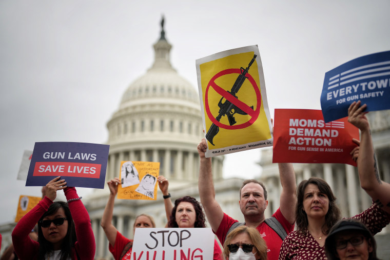 People rally against guns outside the U.S. Capitol on Thursday.