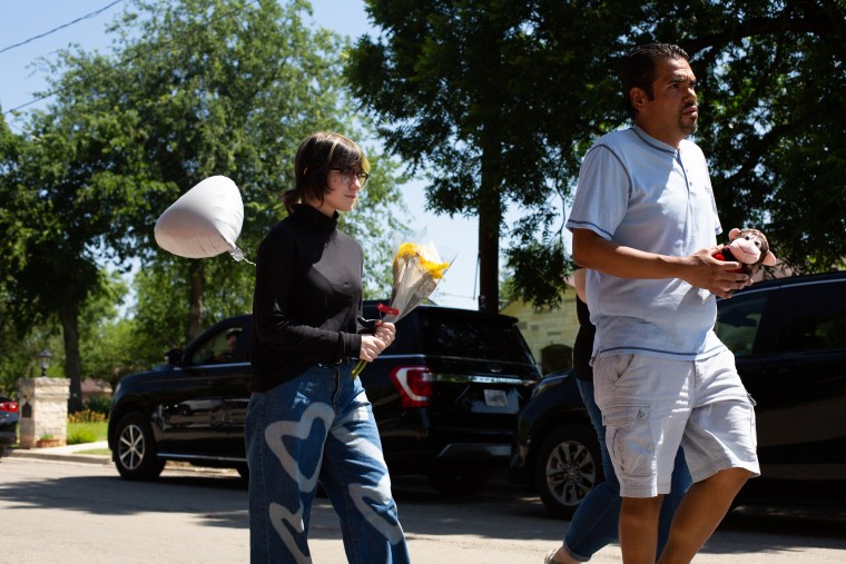 Esmerelda Hernandez brings flowers to the school memorial in Uvalde, Texas on May 26, 2022.