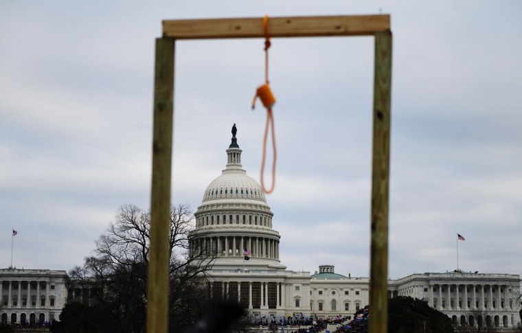 A noose is seen on makeshift gallows as supporters of President Donald Trump gather on the West side of the Capitol