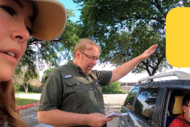 Pastor Evan Edwards and his daughter, Joy, pray for people at a drive-thru event in an undated video.