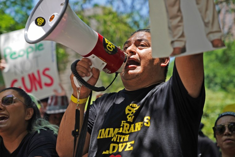 Alain Cisneros protests outside the annual NRA meeting Friday in Houston. 