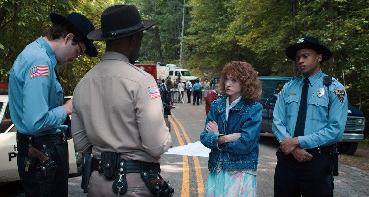 For left, John Paul Reynolds as Officer Callahan, Rob Morgan as Officer Powell and Natalia Dyer as Nancy Wheeler in "Stranger Things."
