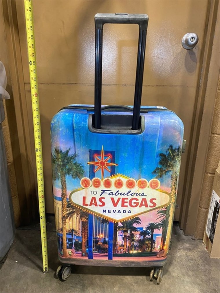 The child’s body was found inside a closed hard-case suitcase with a distinctive Las Vegas design on its front and back.