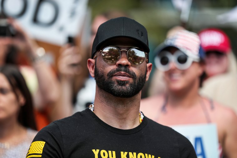Enrique Tarrio, leader of the Proud Boys, stands outside the Conservative Political Action Conference on Feb. 27, 2021, in Orlando, Fla.