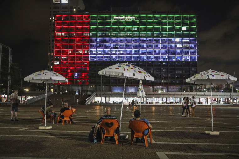 A building in Tel Aviv, Israel, is lit up in the colors of the United Arab Emirates flag on Aug. 13, 2020, following the agreement between the two countries to establish full diplomatic ties.