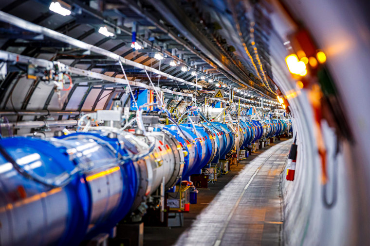 Some of the 1232 dipole magnets that bend the path of accelerated protons are pictured in the Large Hadron Collider in a tunnel of the European Organization for Nuclear Research, during maintenance works on Feb. 6, 2020, in Echenevex, France, near Geneva.