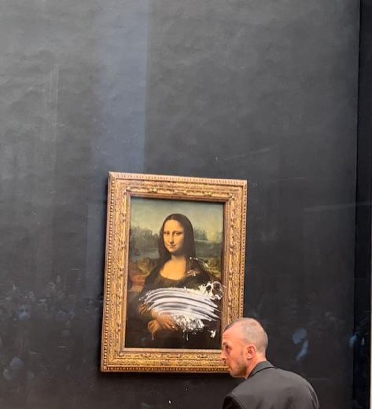 Mona Lisa Attacked in Louvre With Cake By Man Wearing Wig