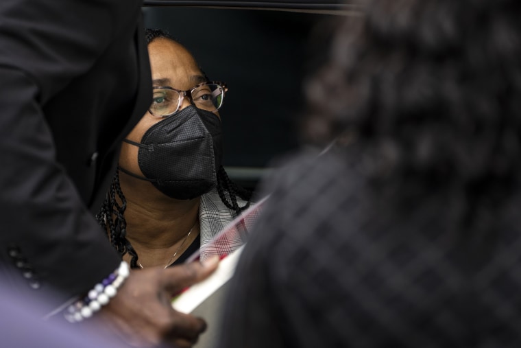 A family member looks at a photo of the late Heyward Patterson, as mourners depart from the funeral at Lincoln Memorial United Methodist Church on Friday, May 20, 2022 in Buffalo, NY. The Patterson was one of 10 people who were killed in the mass shooting