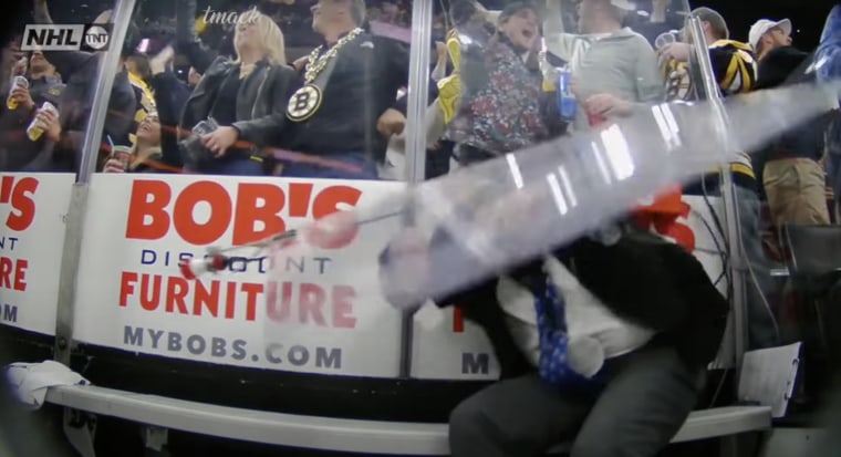 Fans accidentally dislodged a pane of glass, causing it to fall on an official. 