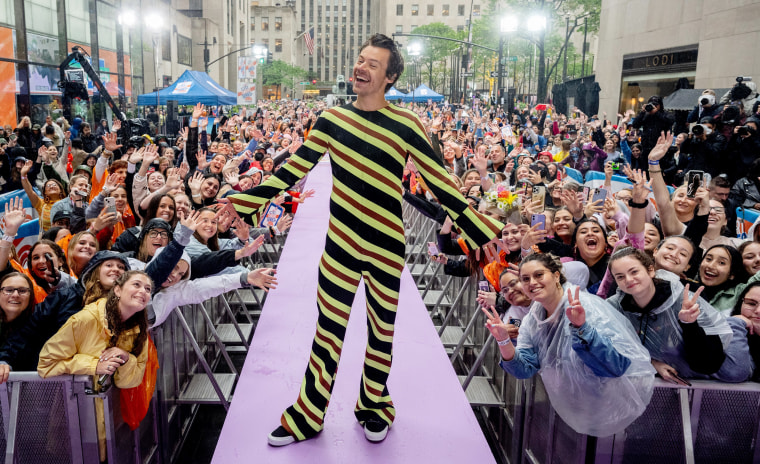 Styles candy-striped onesie was a hit with fans on the plaza. "I wanted to be comfortable," he told Hoda Kotb.